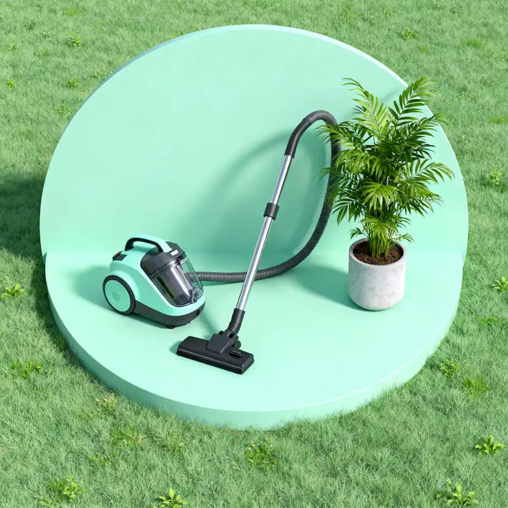 Haushaltsgerät und Zimmerpflanze auf mintfarbenem Hintergrund